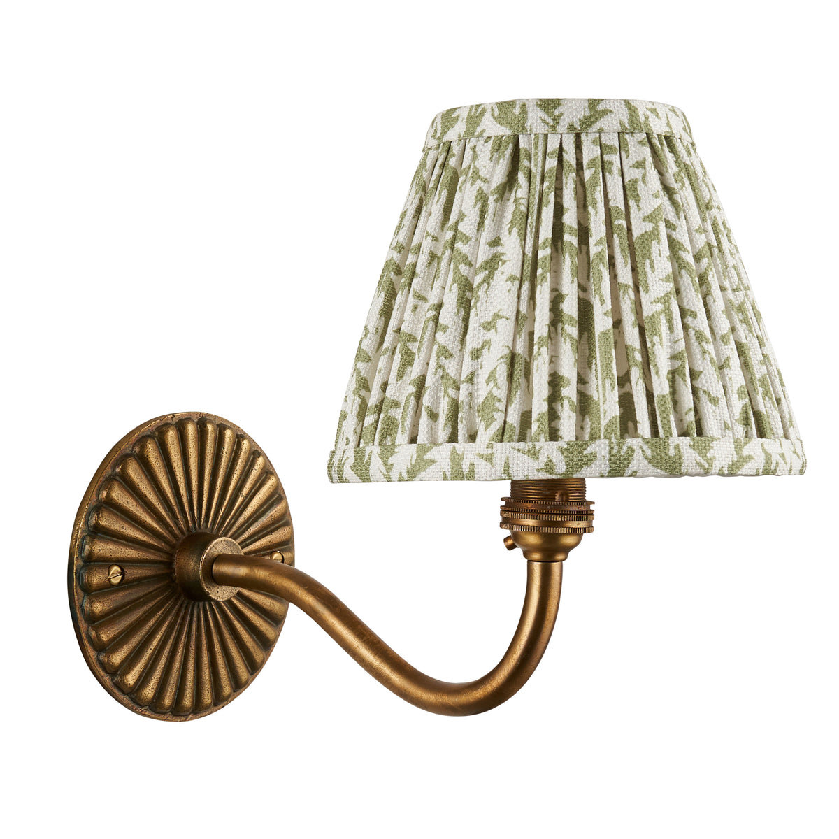 Dahlia Curve antique brass wall light with green foliage pleated shade on white background