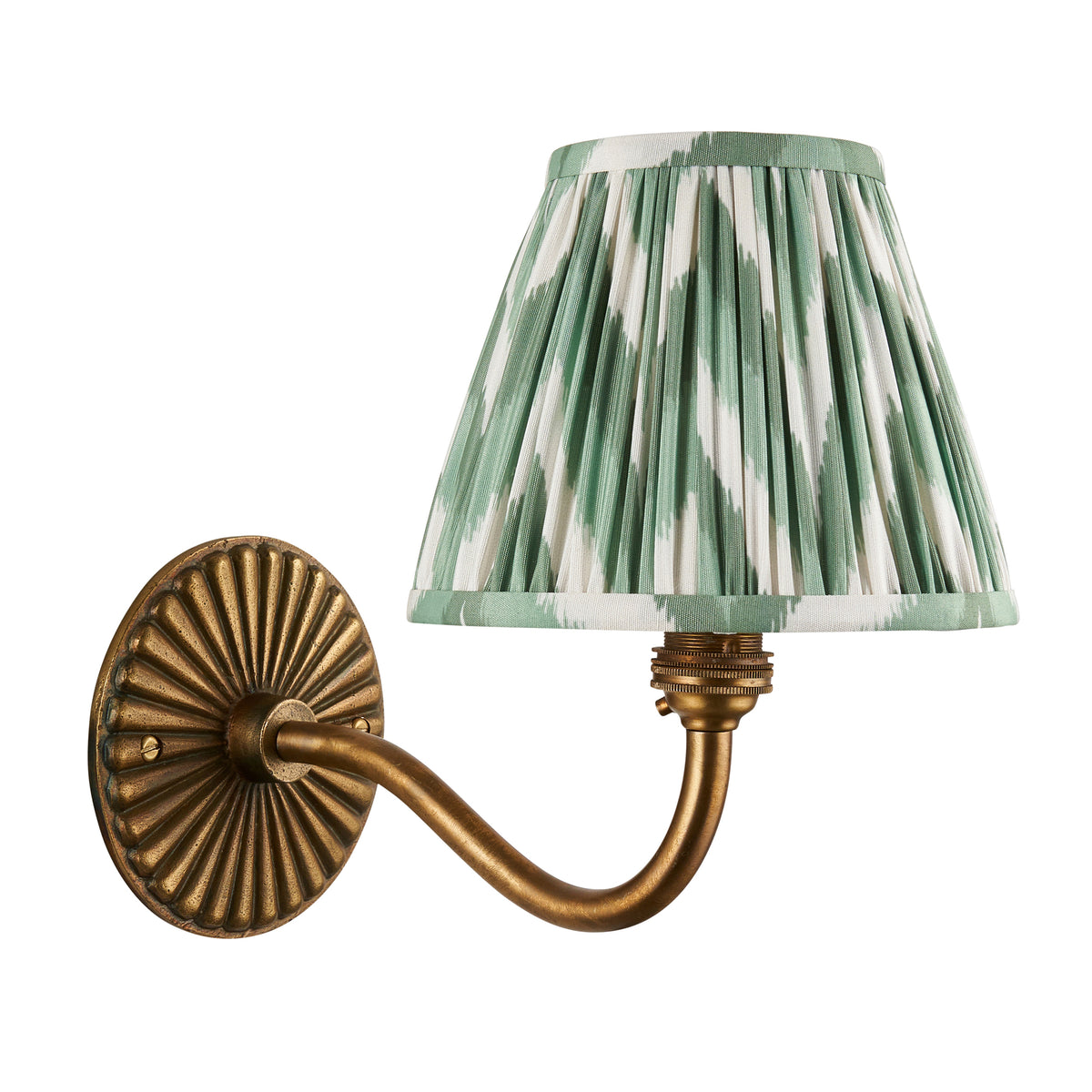 Dahlia Curve antique brass wall light with green ikat pleated shade, studio shot on white