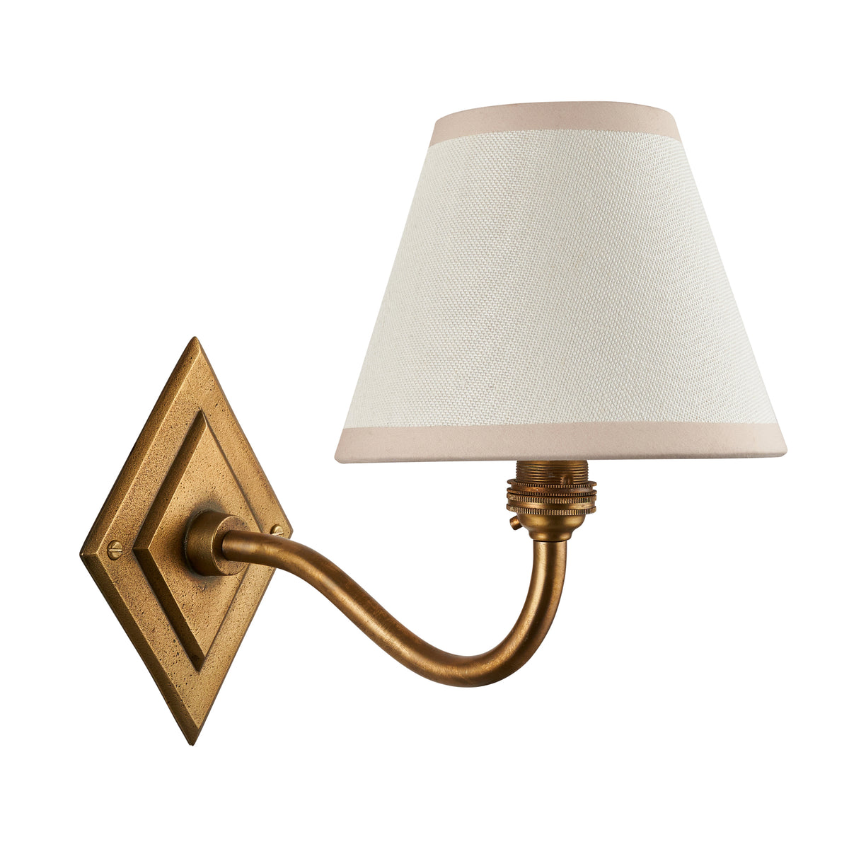 Diamond Curve antique brass wall light with cream fabric shade on a white background