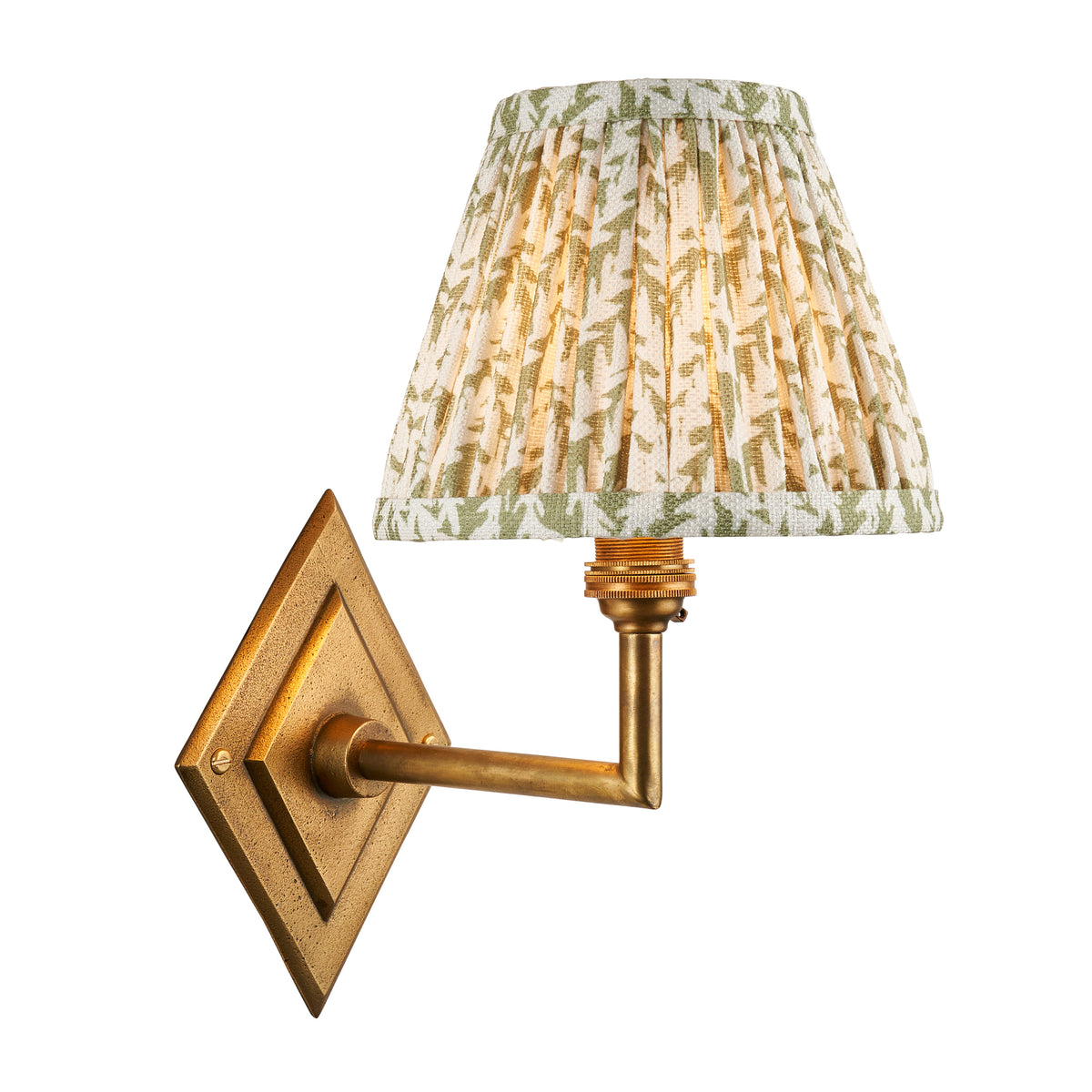 Diamond Angle antique brass wall light with a pleated green leaf-print tapered shade, lit