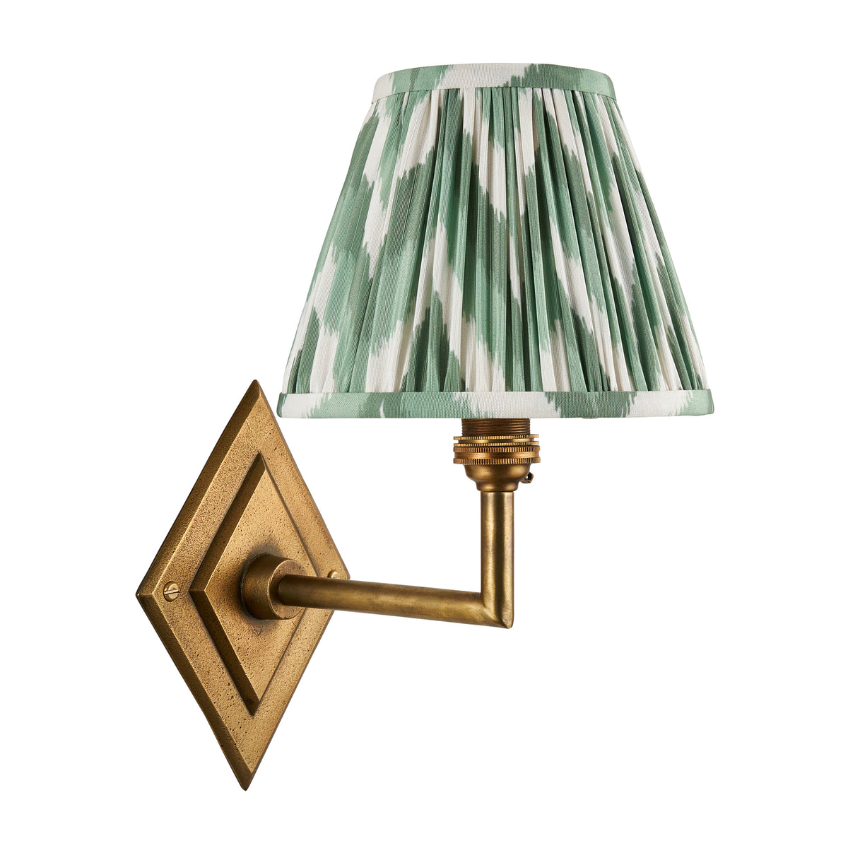 Diamond Angle antique brass wall light fitted with a green ikat pleated shade, unlit