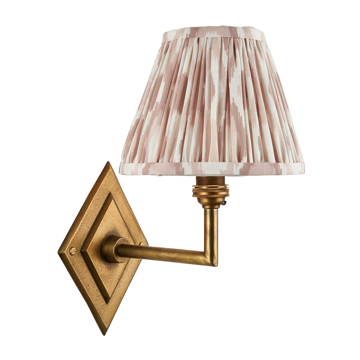 Diamond Angle brass wall light fitted with a natural ikat pleated shade, unlit