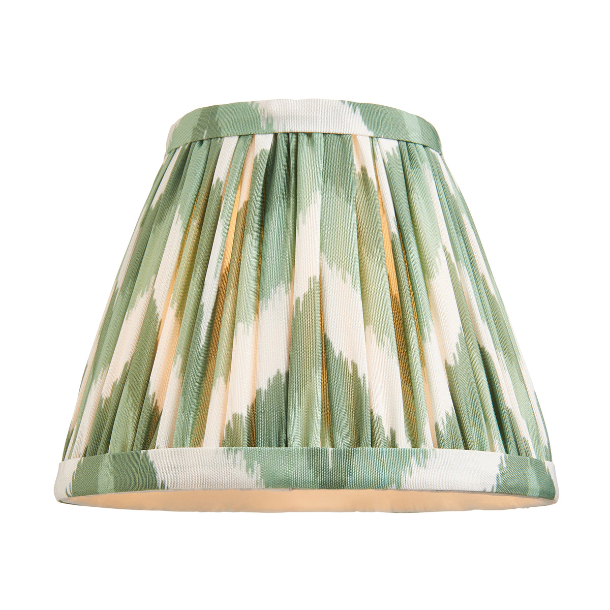 Tapered pleated shade in green and cream zigzag ikat, photographed on its own