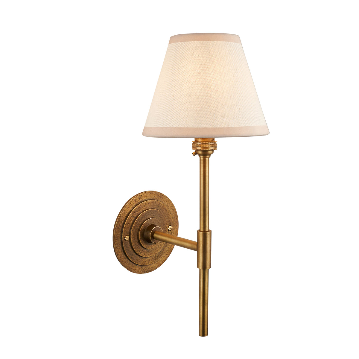 Halo antique brass wall light with slim stem, stepped round backplate and vintage white tapered shade