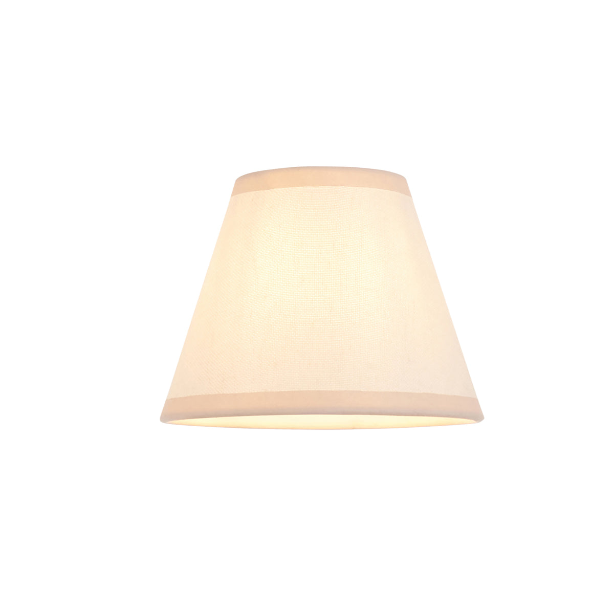 Vintage white tapered fabric shade shown alone, lit from within with a soft cream tone