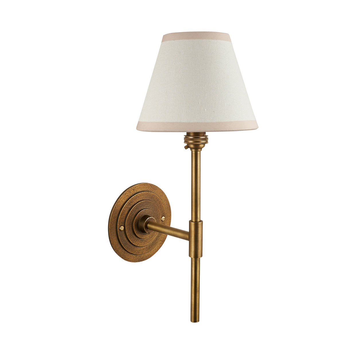 Halo antique brass wall light with cream tapered shade, straight-on product view