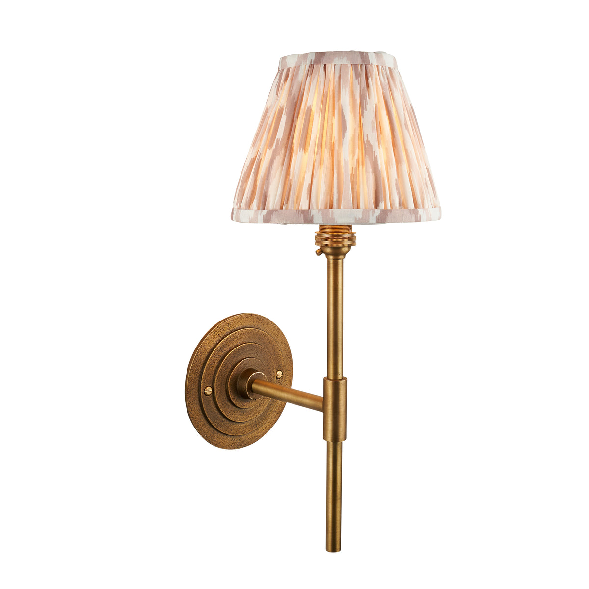 Halo Tall antique brass wall light with pleated natural ikat shade and round stepped backplate
