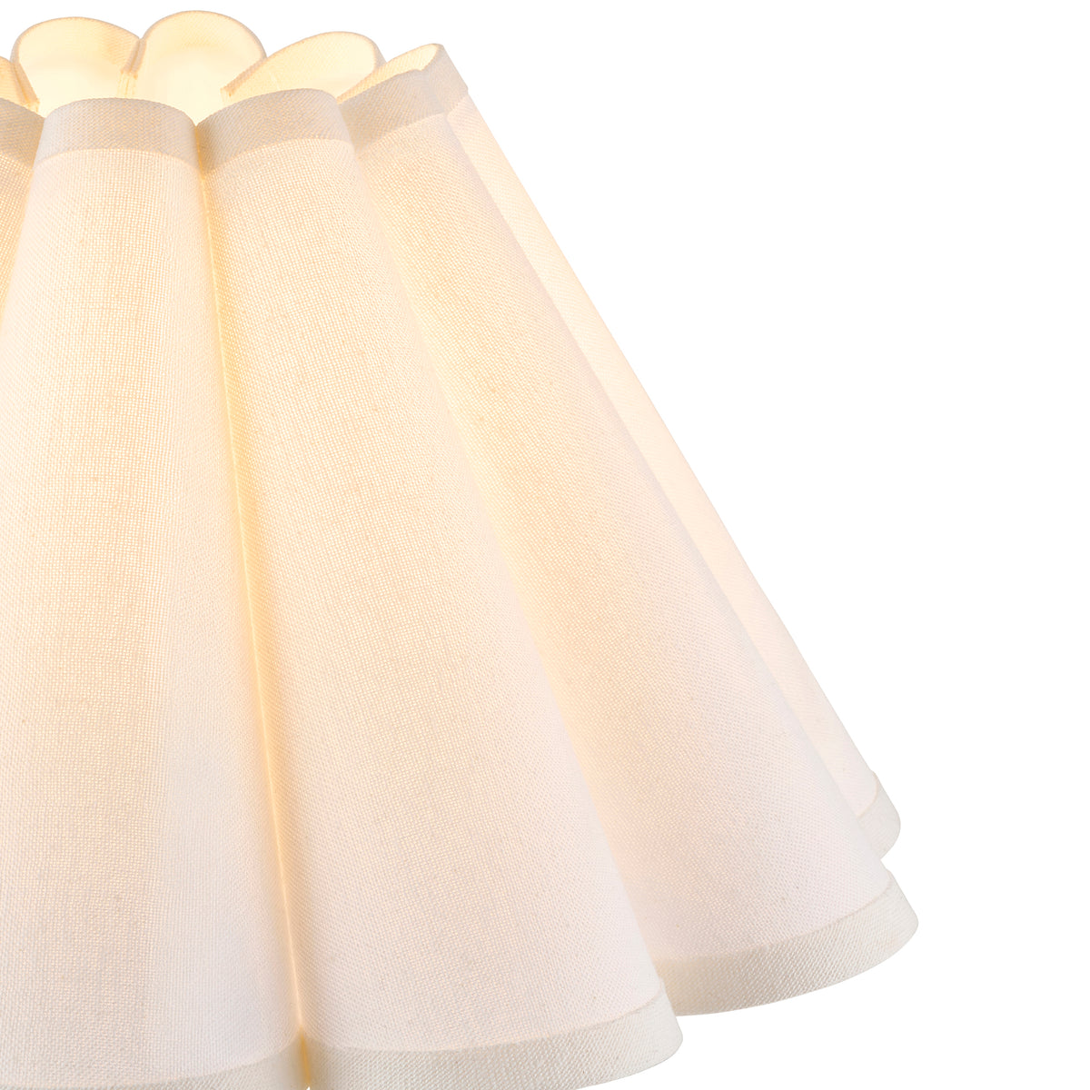 Close-up of the lit Ayla shade showing fluted folds and trimmed scalloped edge