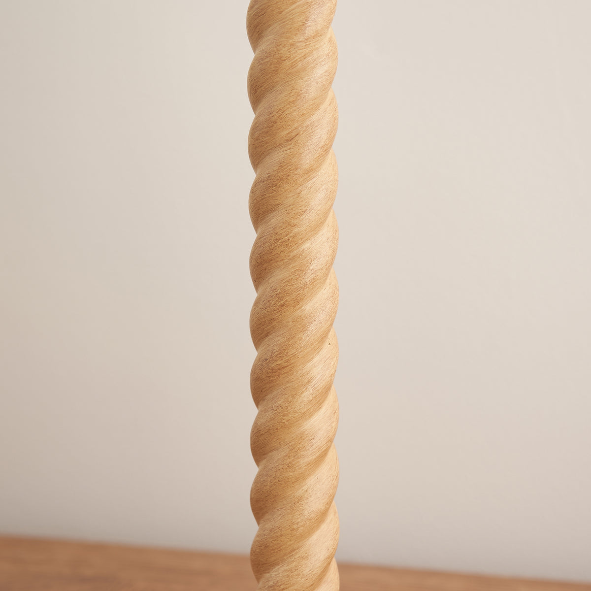Close-up of the spiralled oak effect stem of the Twist table lamp base