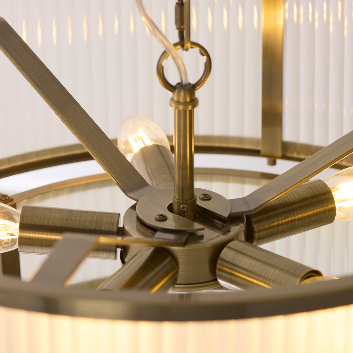 Interior view of the Ridgeton pendant showing its antique brass spokes and lamp holders