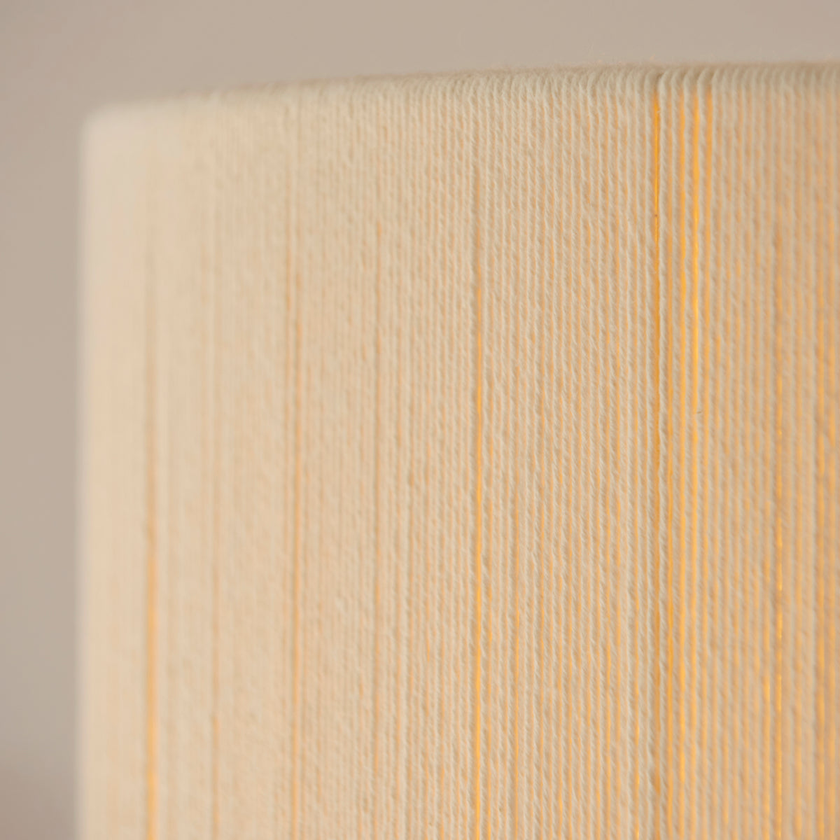 Macro detail of the cream string winding on the Noah pendant shade