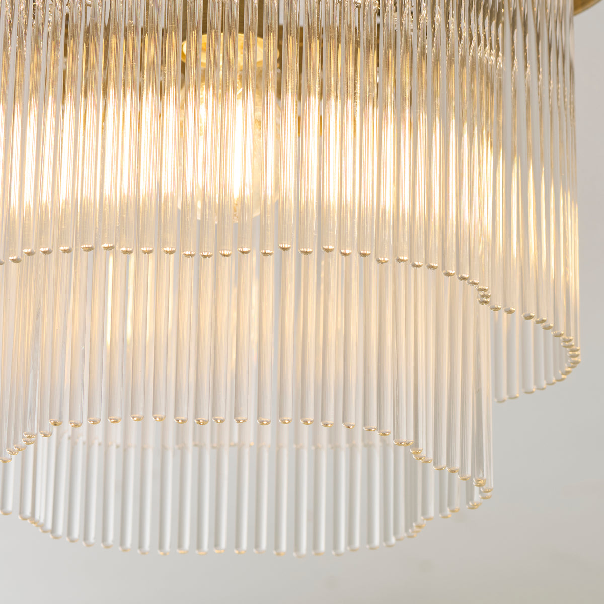 Detail of the Lucille shade's two tiers of clear glass rods glowing with warm light