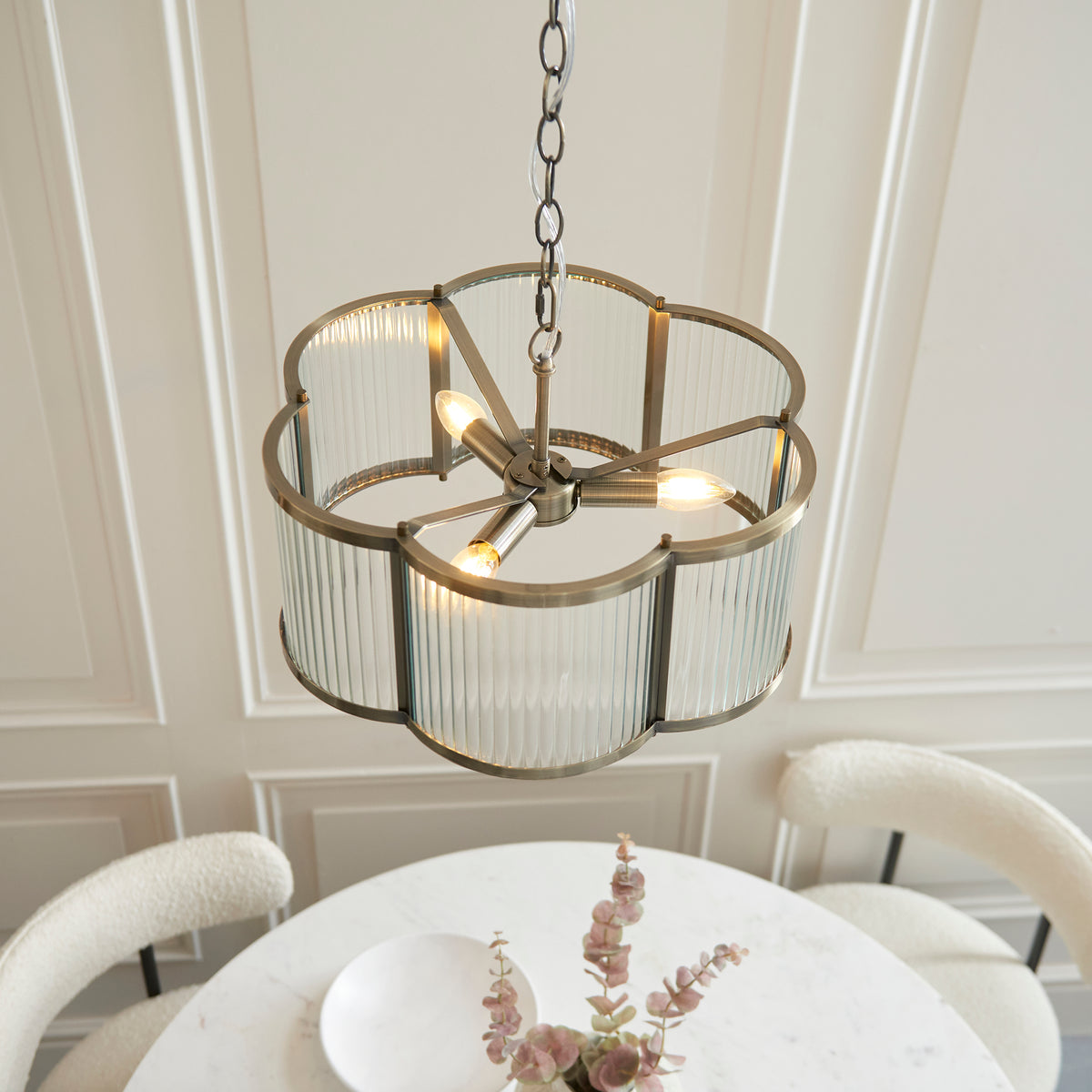 Ridgeton Scallop pendant viewed from above, showing three lamps inside the scalloped brass frame