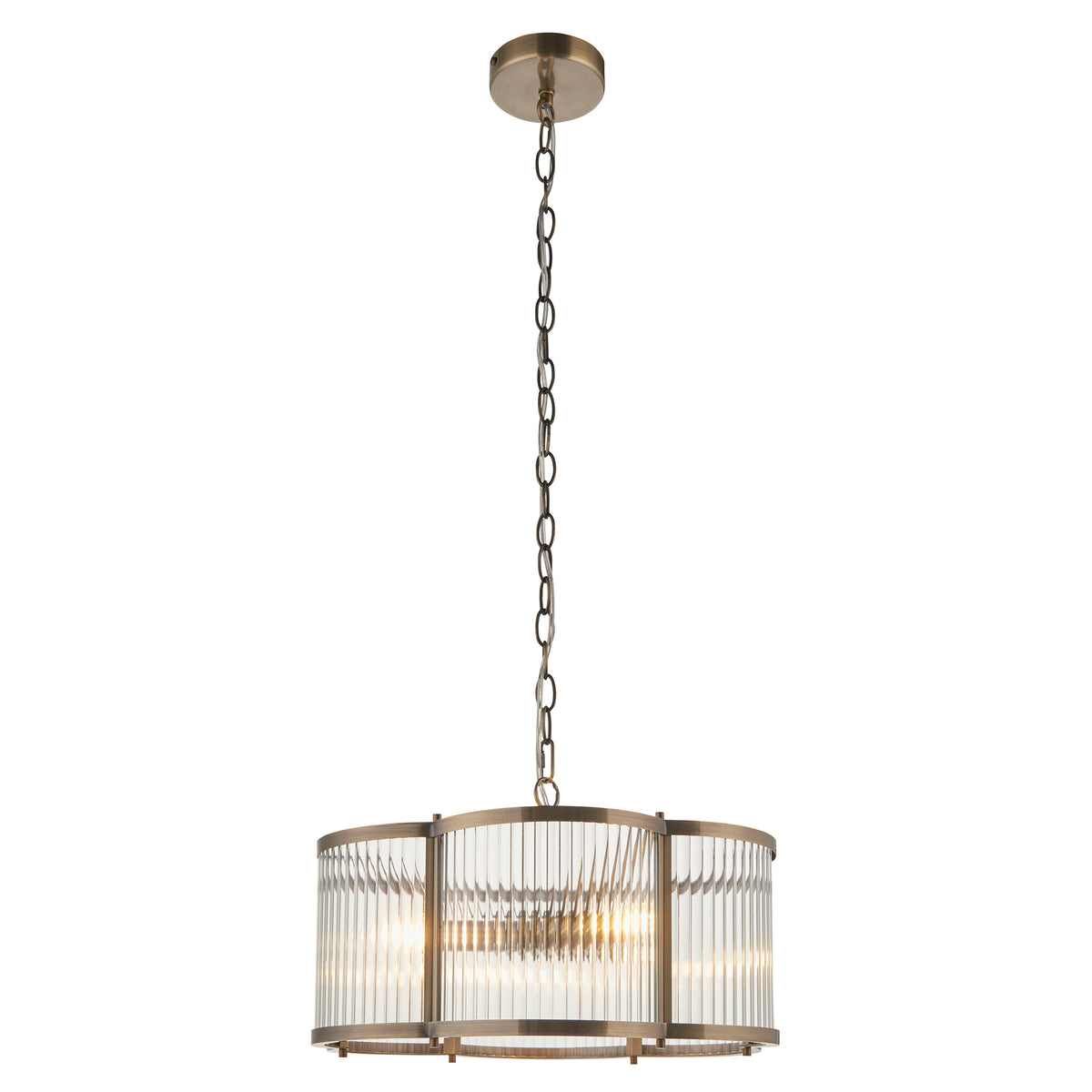 Ridgeton Scallop antique brass pendant with ribbed glass, lit on a plain background