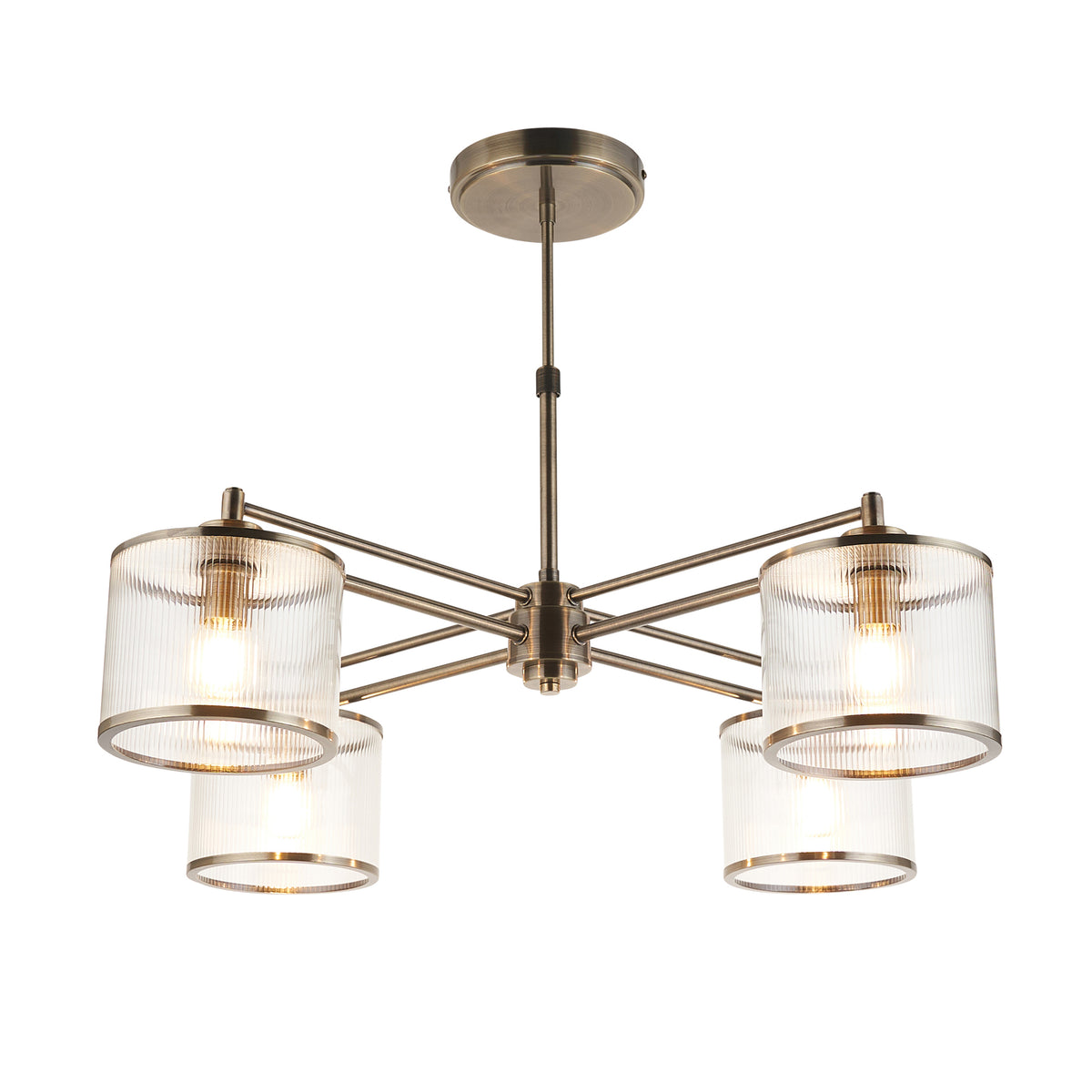 Ridgeton antique brass chandelier with four ribbed glass shades, lit on a white background