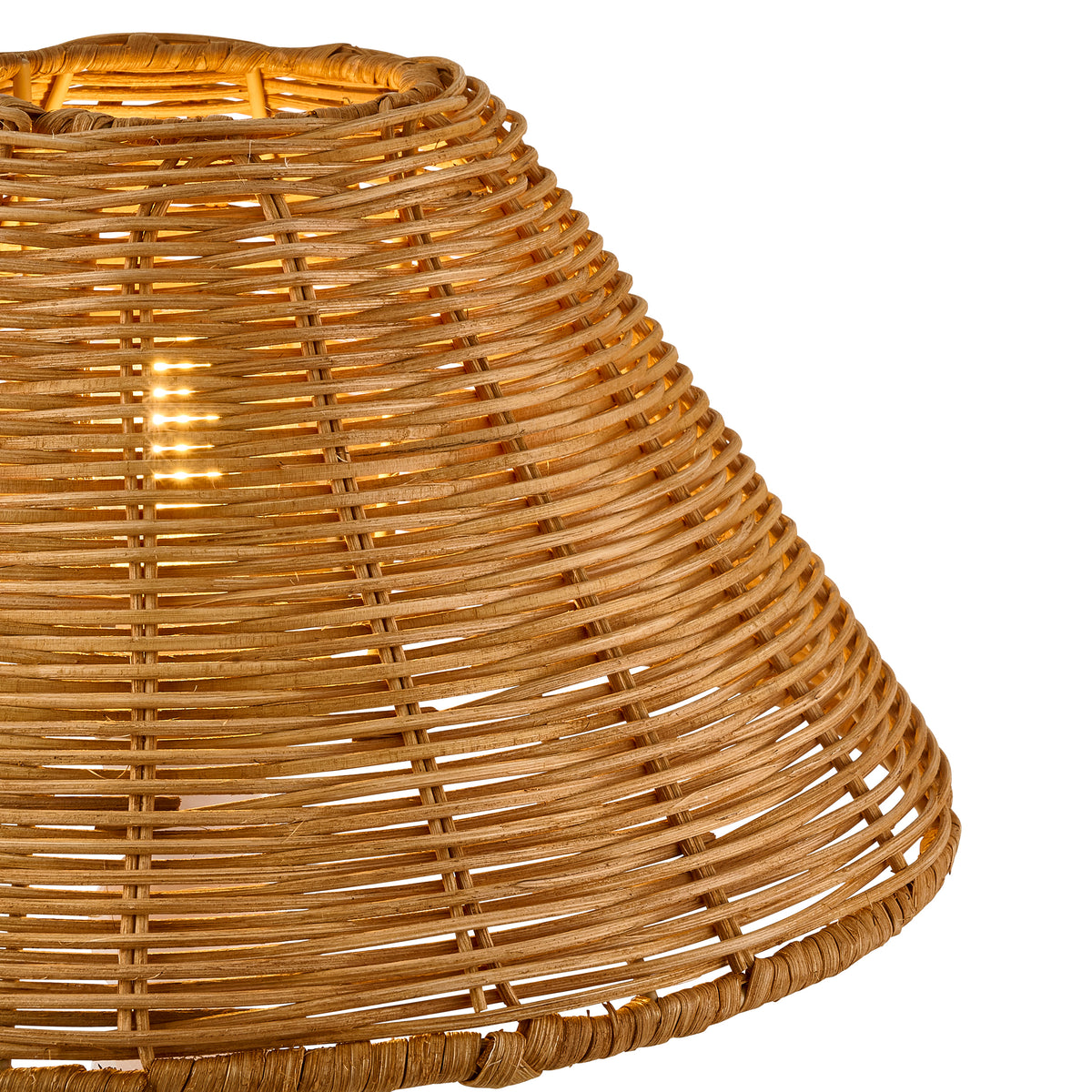 Close-up of the tapered dark rattan shade's cane rows and warmly lit interior