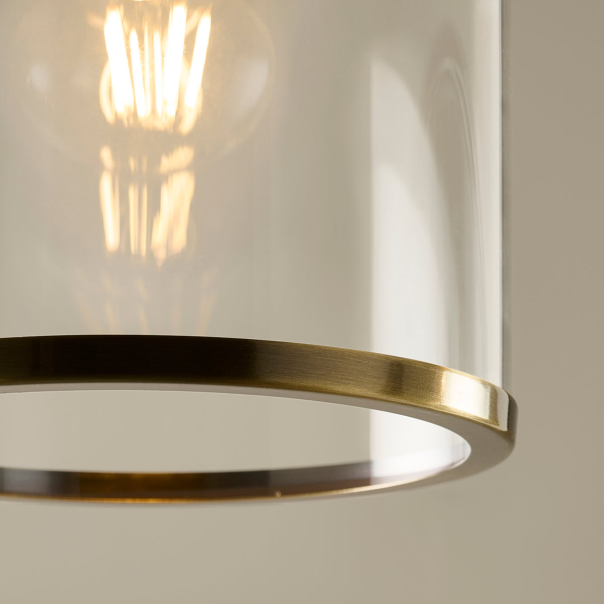 Detail of the Hebden pendant's brass chain, hook and top plate above the glass shade