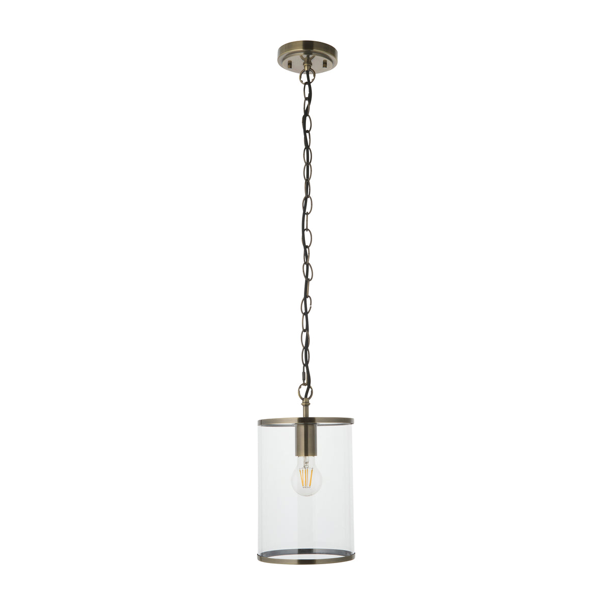 Hebden brass pendant with lit bulb hanging from a white ceiling in a green painted room