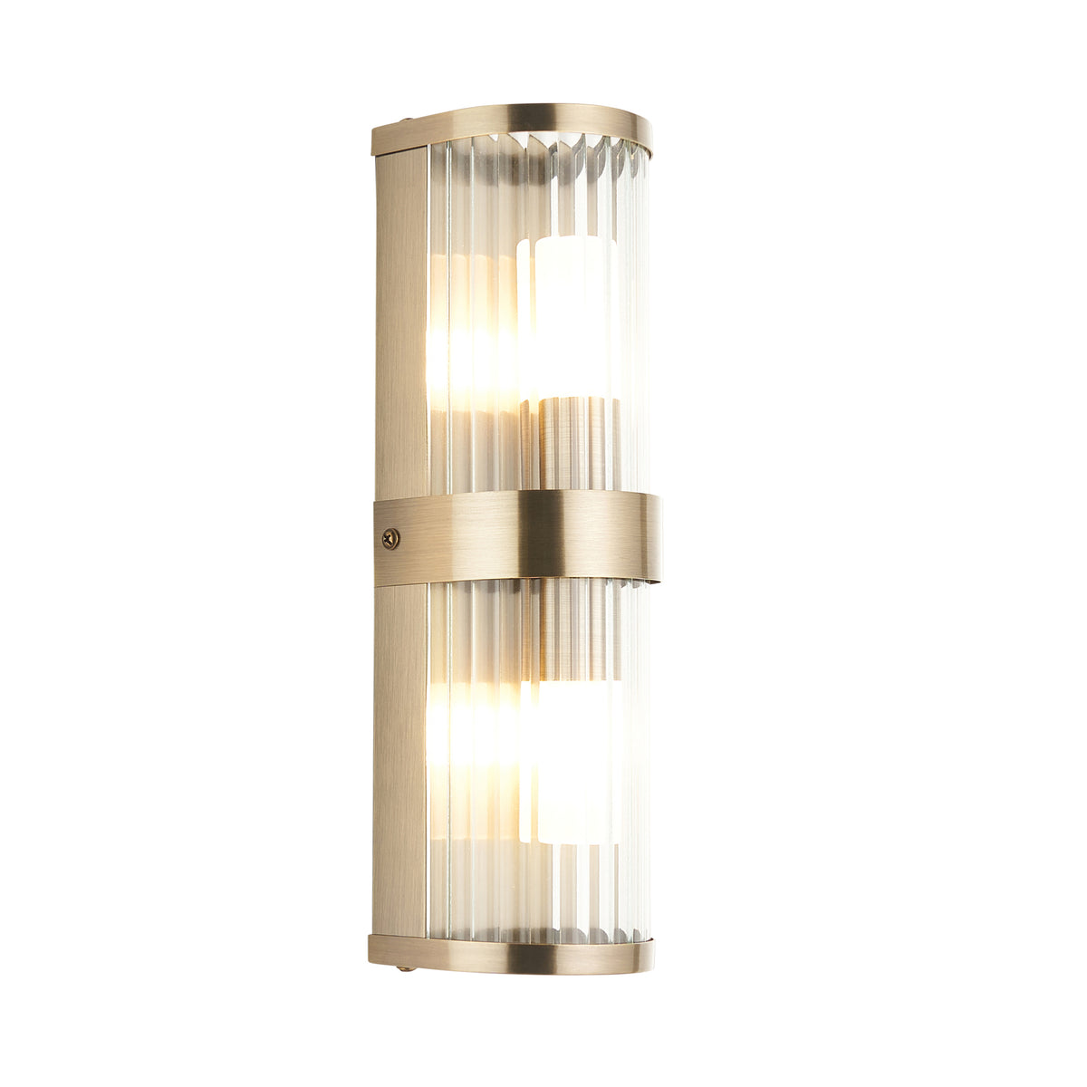 Ridgeton antique brass bathroom wall light with twin ribbed glass cylinder shades, lit