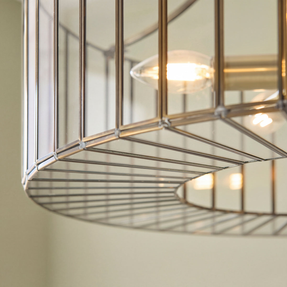 Underside close-up of the Antalya pendant showing the slatted brass base ring and glass panels