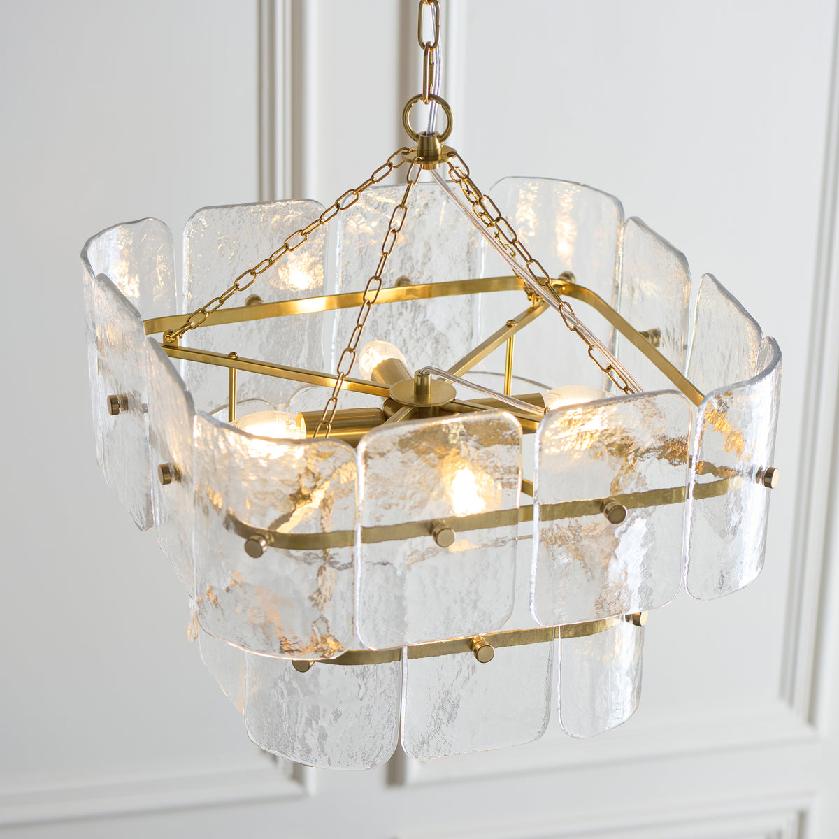 Venice pendant viewed from above, showing the brass frame and clear textured glass panels