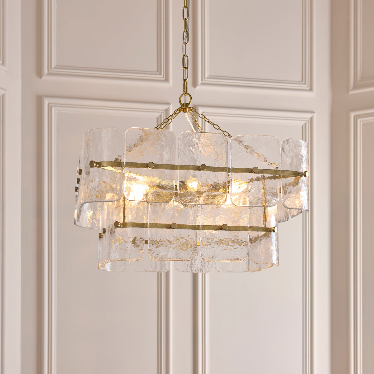 Venice pendant's glass tiles glowing warmly against panelled walls