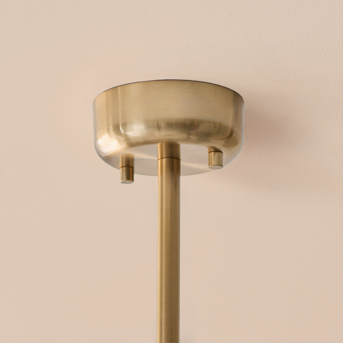 Brushed aged brass ceiling rose and drop rod of the Ottowa pendant