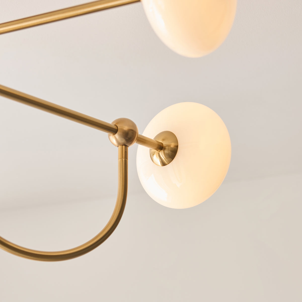 Ottowa four-light semi flush ceiling light in aged brass with opal glass shades, unlit