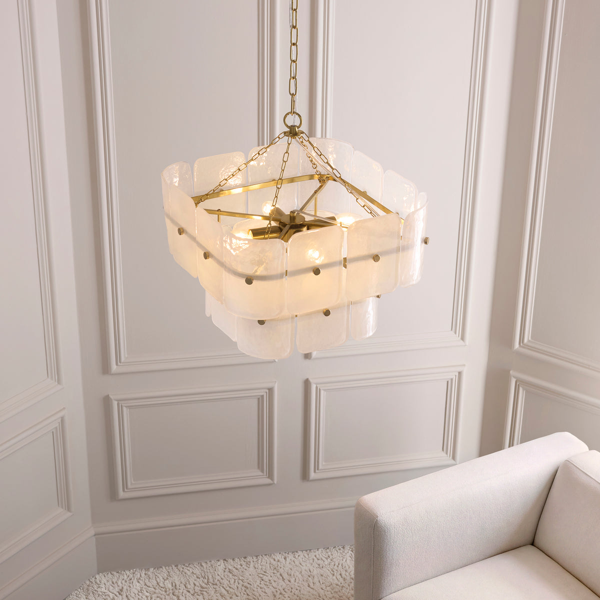 Venice pendant viewed from below in a panelled room, showing its square brass frame and glass tiers