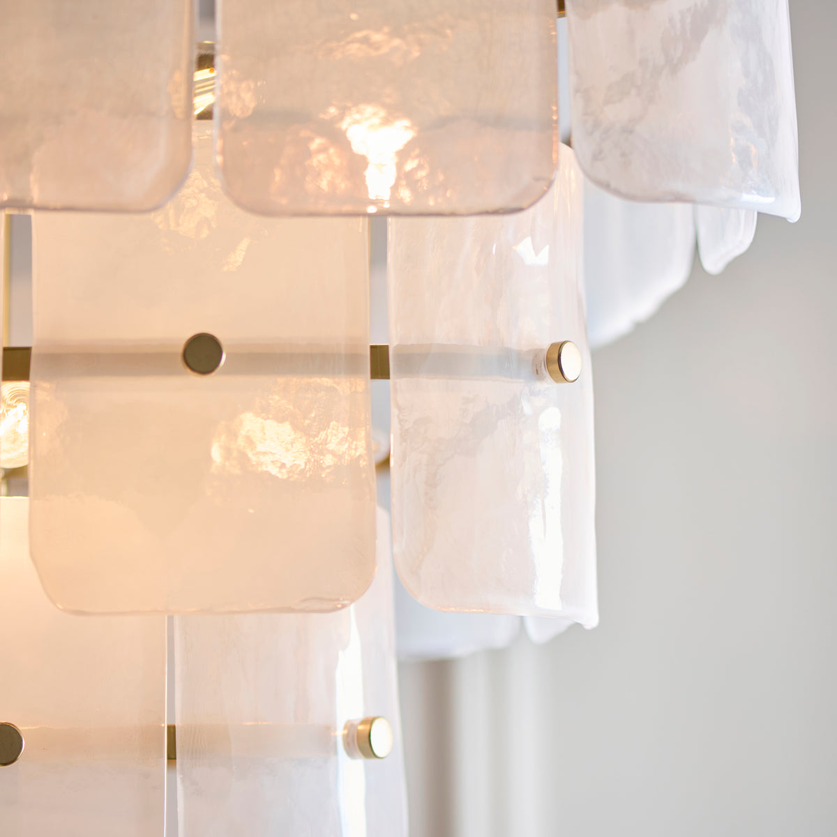 Detail of the lowest tier of the Venice chandelier, showing translucent textured glass panel edges