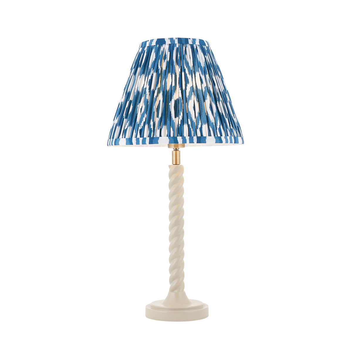 Twist & Ikat almond white table lamp with twisted stem and pleated blue ikat shade