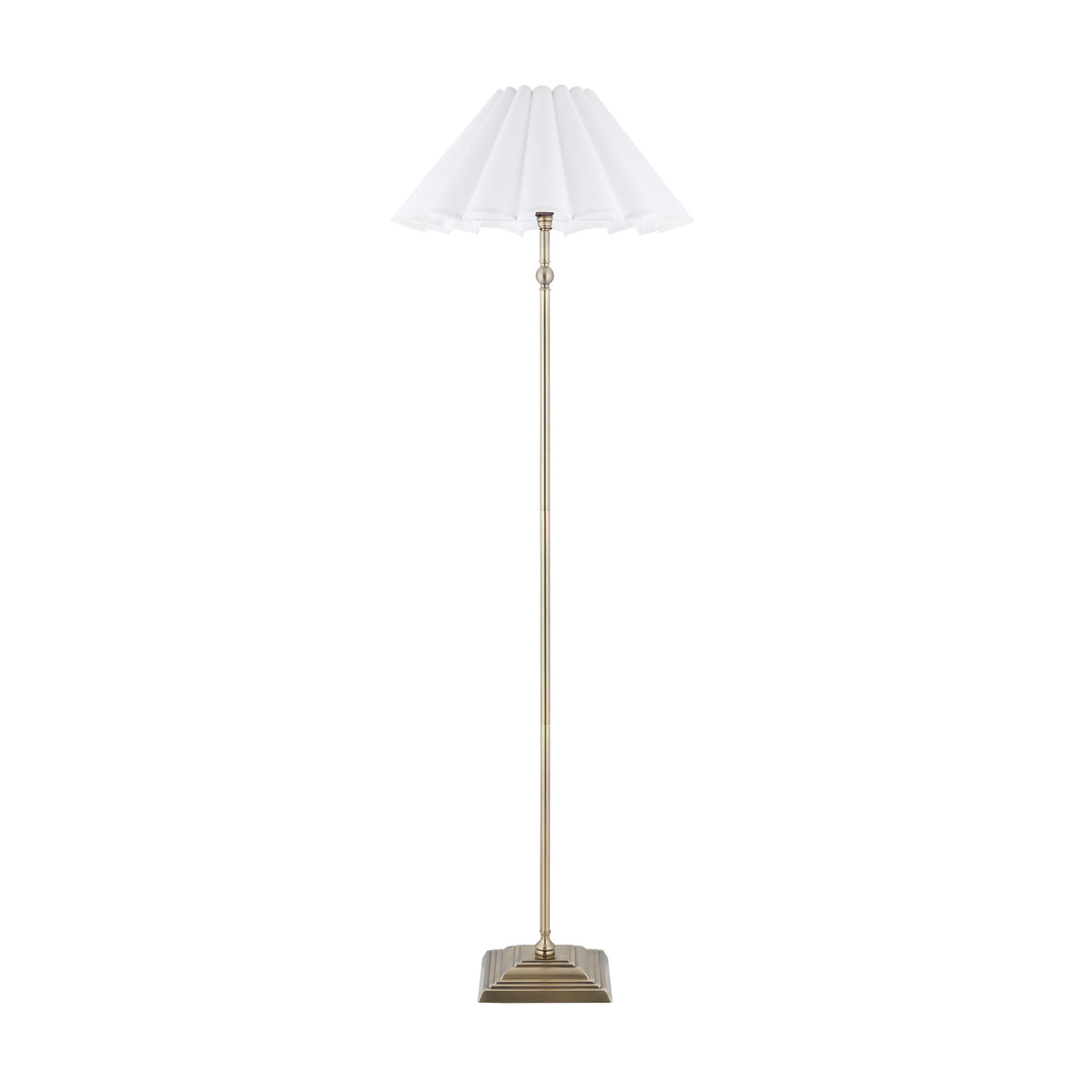 Sylvie antique brass floor lamp with white scalloped shade shown unlit against white