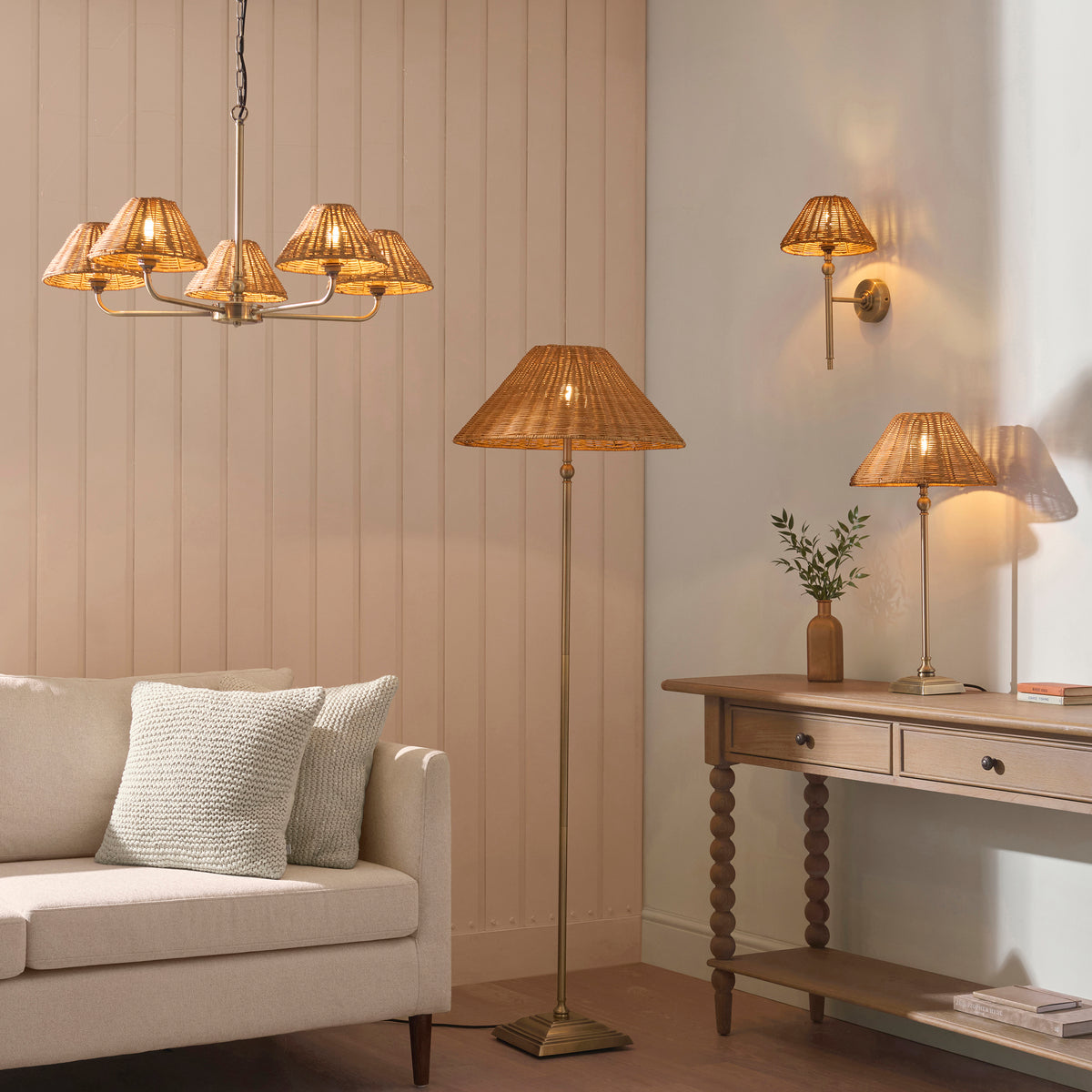 Jericho brass rattan range lit in a living room with sofa, floor lamp, wall light and console