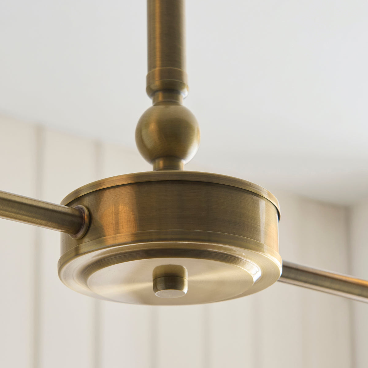 Underside of the Jericho linear pendant's brass housing and arms
