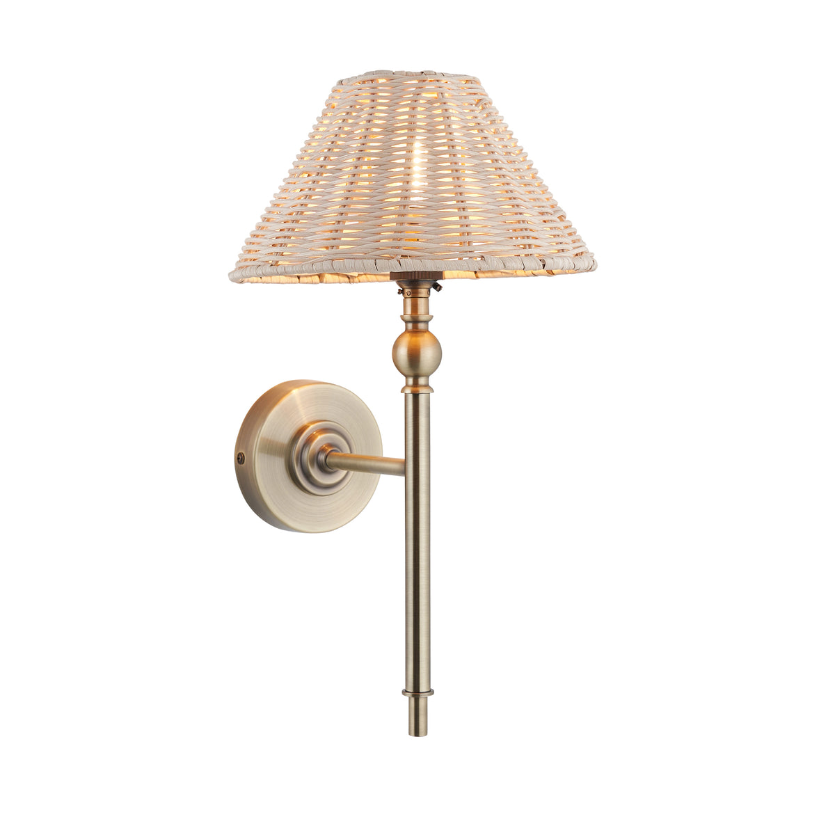 Jericho antique brass wall light with a natural woven rattan coolie shade and turned stem