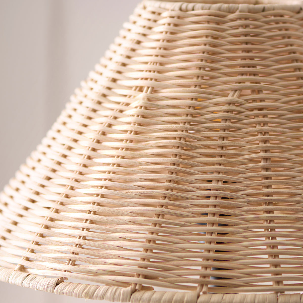 Macro detail of the cream natural rattan weave on the Jericho table lamp shade