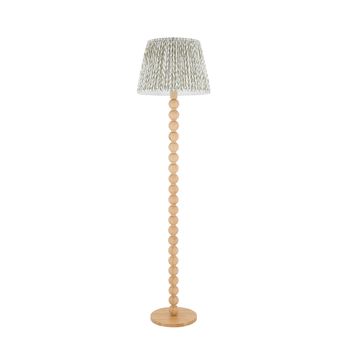 Cane & Leaf natural bamboo floor lamp shown full length with green leaf pleated shade