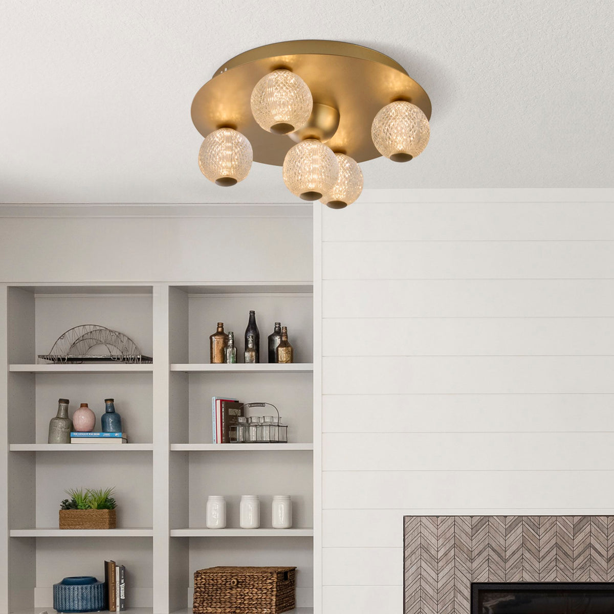 Living room alcove shelving beside the Asteroid gold globe ceiling light and fireplace