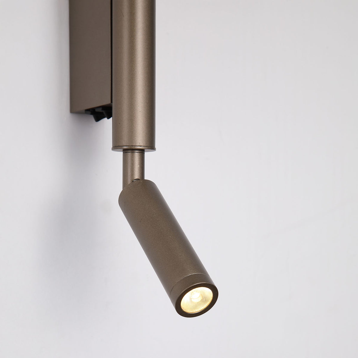 Close-up of the Architect reading light head and swivel joint in latte metallic finish