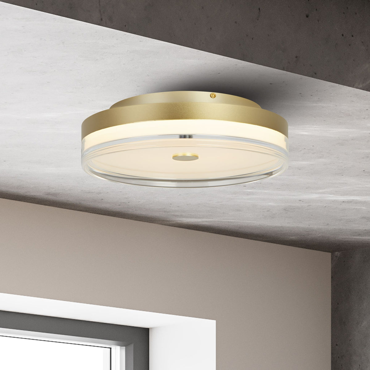 Cyprus gold flush ceiling light lit on a concrete ceiling beside a window in a minimalist interior