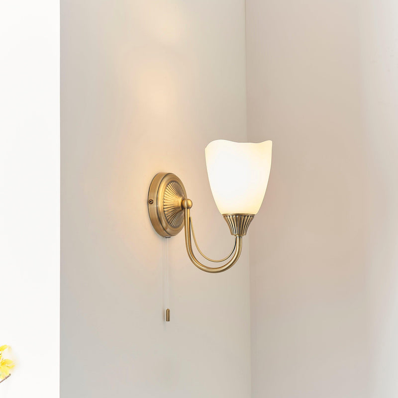 Endon Haughton Antique Brass Finish Single Arm Wall Light Fitted to the Wall With Light On