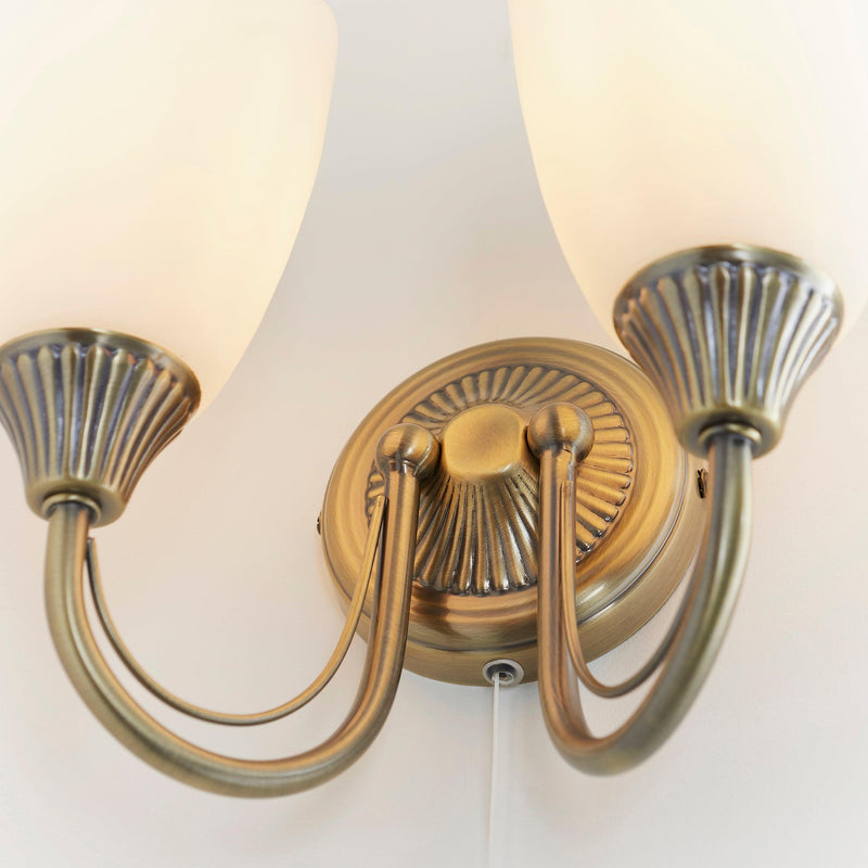 Endon Haughton Antique Brass Finish Twin Arm Wall Light Close Up Showing Arms And Backplate