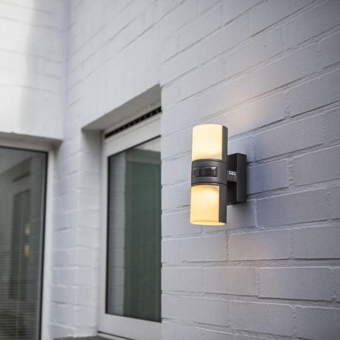 Lutec Cyra Grey Adjustable LED Wall Light - Motion Sensor 5198102118 attached to an outside wall