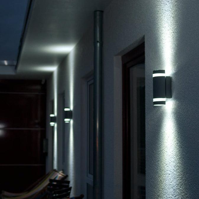 Lutec Focus Black Outdoor Up & Down Wall Light With Dusk To Dawn Sensor outside a front door