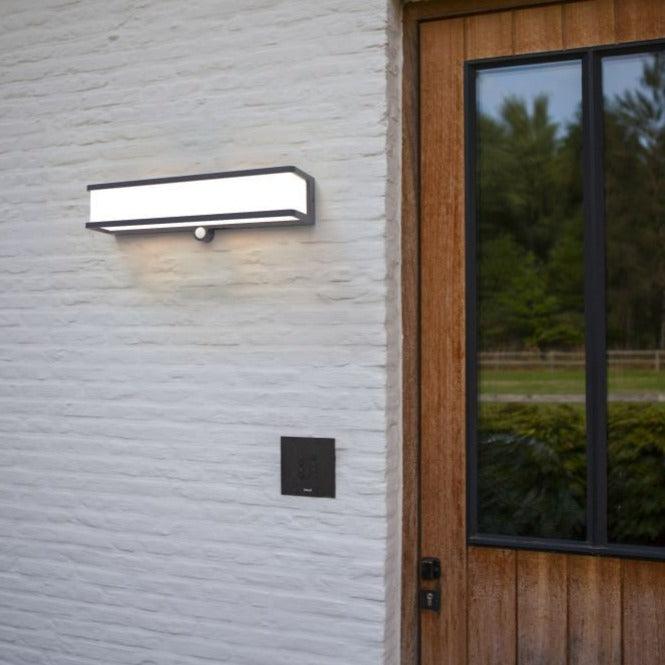 Lutec Doblo Solar LED Grey Wall Light - Motion Sensor 6943801125 outside a back door