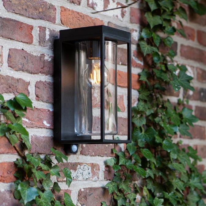 Lutec Flair Solar PIR Outdoor Wall Light - Black 6988804012 - attached to a wall