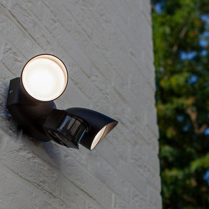 Lutec Shrimp PIR Outdoor LED Spotlight Wall Light - Black 7622222012 attached to an outside wall