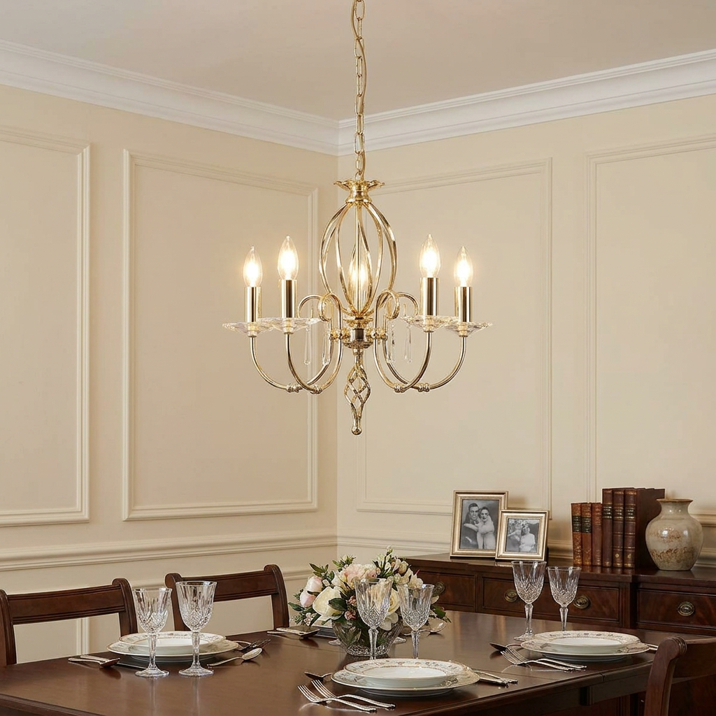 Aegean 5 Light Polished Brass Chandelier hanging above an elegant dining table with crystal glassware.