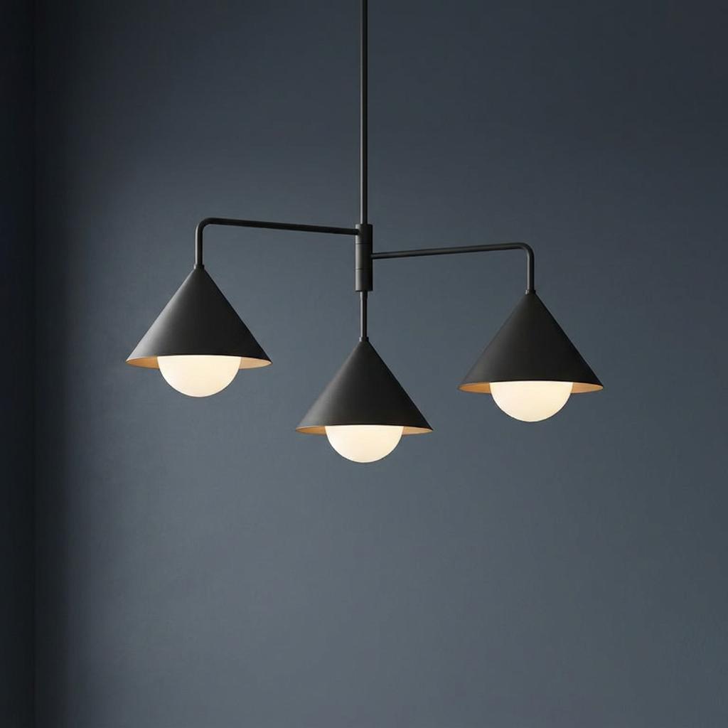 Matte black three-light chandelier featuring cone shades and white globe bulbs against a dark blue background.
