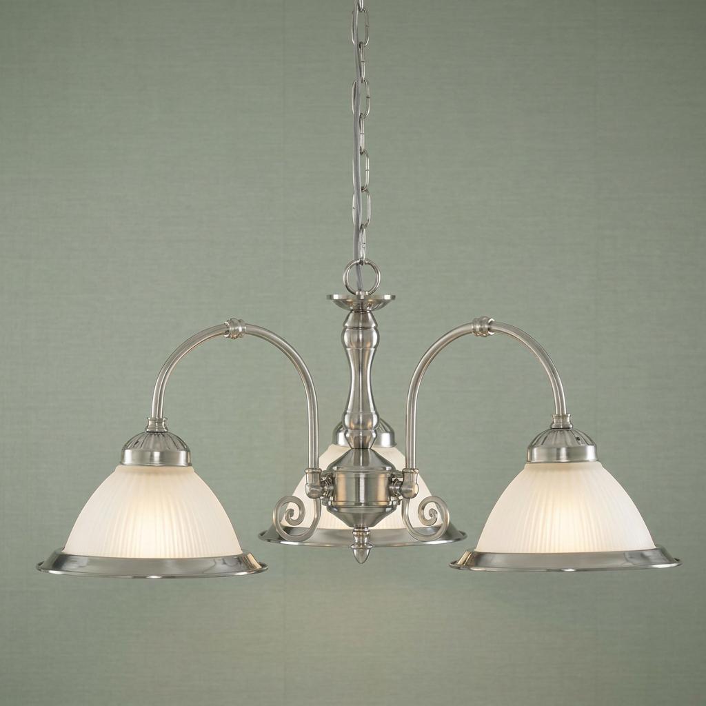 American Diner 3-light pendant with satin silver finish and frosted ribbed glass shades against a green wall.